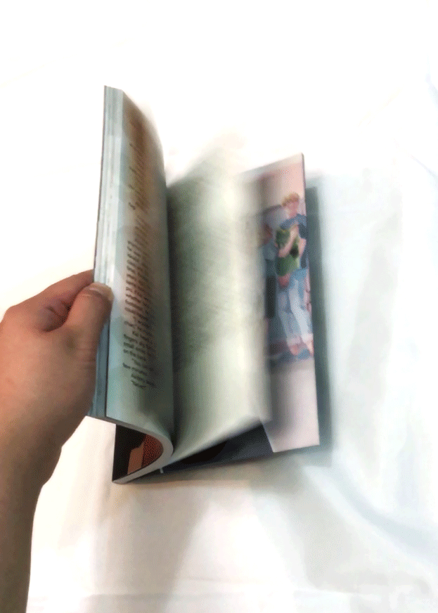 A gif of a Boomerang; someone is flipping through the zine to show off the interior.