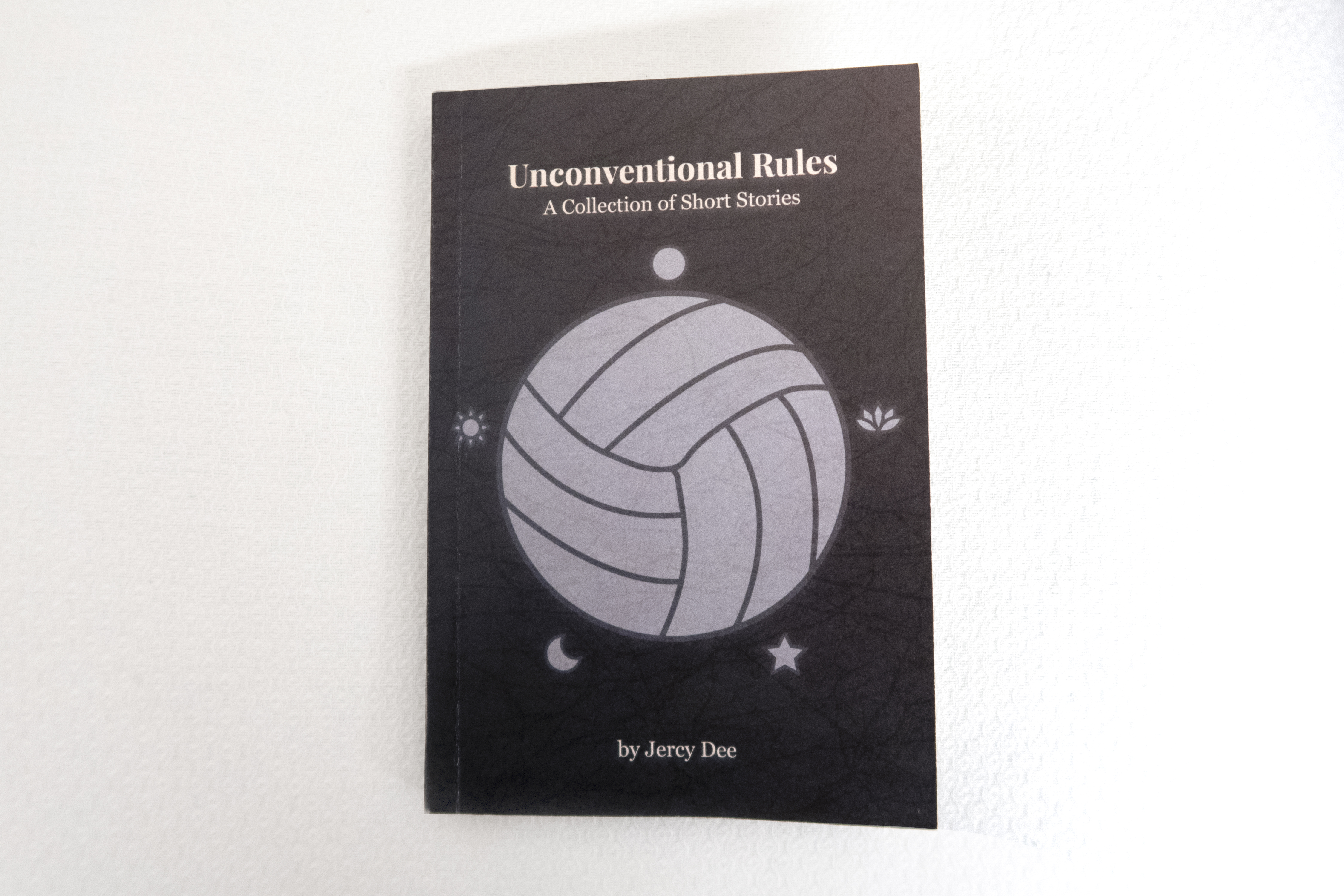 A printed copy of Unconventional Rule's front cover.